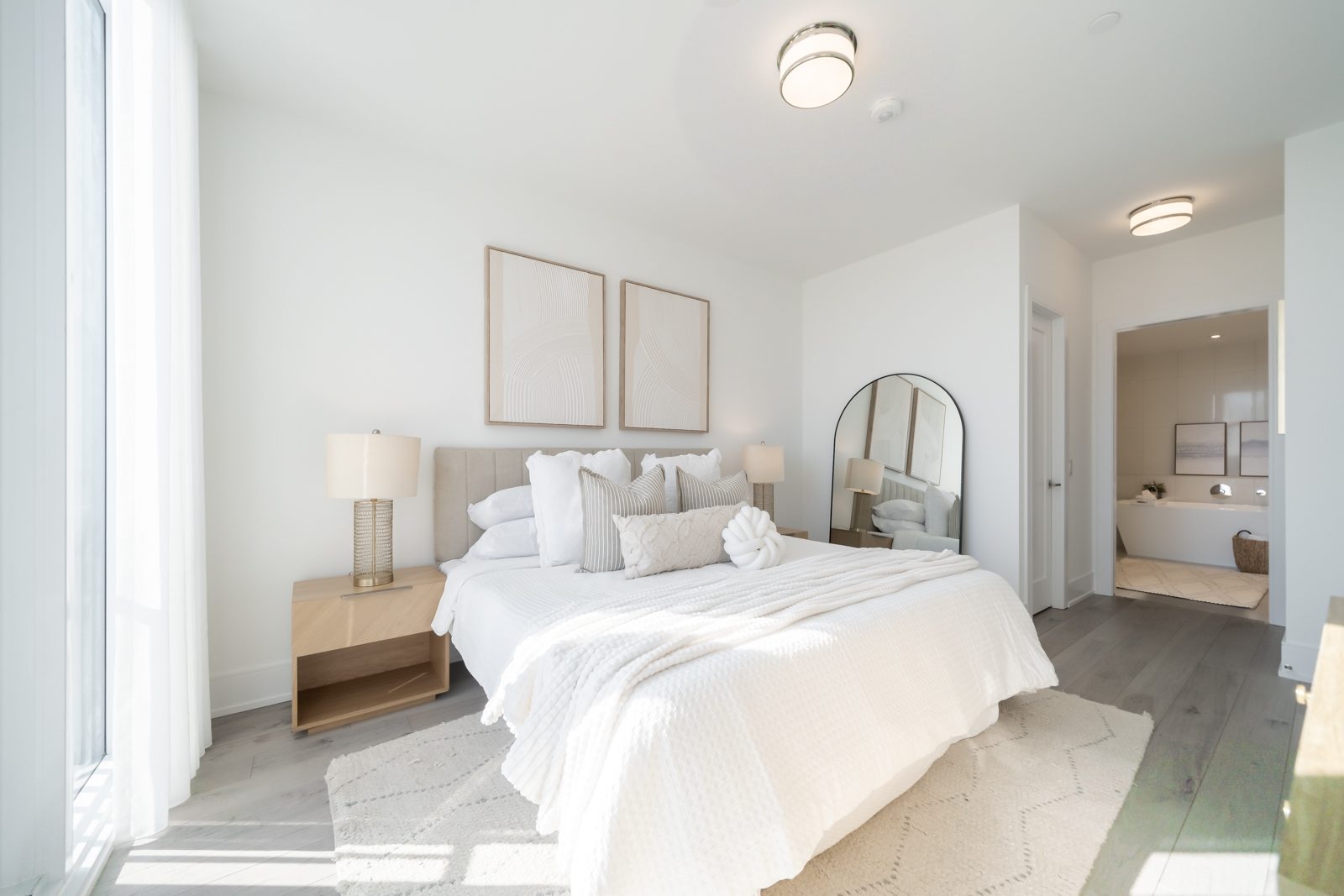 Primary bedroom with a view into the ensuite
